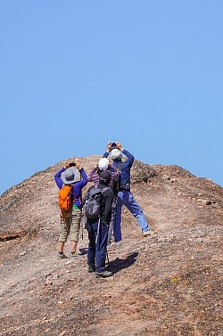 Tourists traveling on a hill